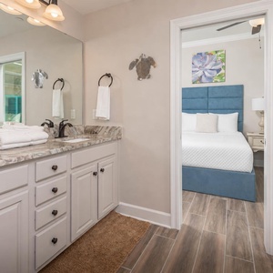 Freshen up in this guest bath in the relaxing shower or soothing tub before an exciting beach day
