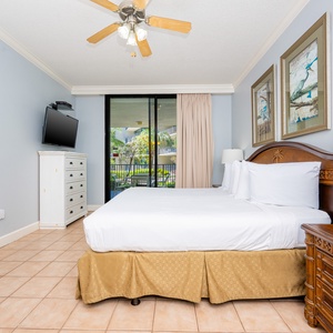 Retreat to the king master suite with cozy bedding and drift off to coastal sights and sounds of the bay