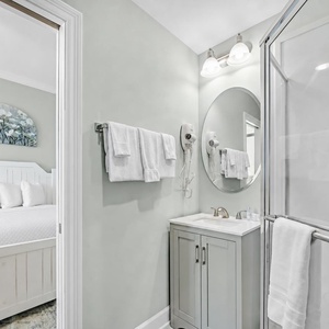Freshen up in this guest bath in the relaxing shower before an exciting beach day