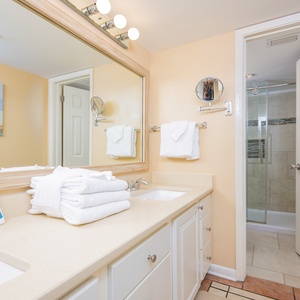 Indulge in a refreshing morning routine in the master bath with a spacious vanity and walk-in shower