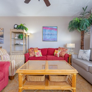 Unwind in the inviting living area, featuring a sofa with queen sleeper and a dining table perfect for meals and gatherings