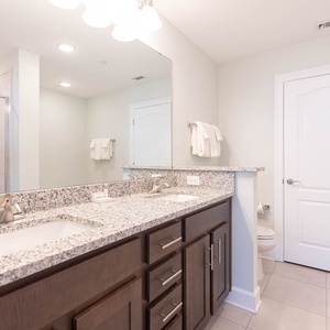 Wake up to a refreshing morning routine in the master bath with a walk-in shower and relaxing tub