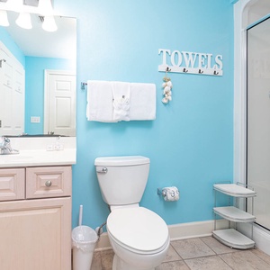 Refresh in this guest bathroom featuring a spacious vanity, modern fixtures, and a walk-in shower for your convenience