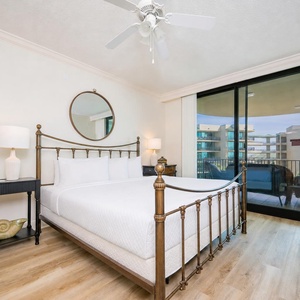 Retreat to the king master suite with cozy bedding and drift off to coastal sights and sounds of the bay