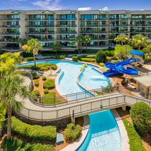 Discover the refreshing pool area with an inviting lazy river and thrilling waterslide