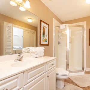 Refresh in this additional guest bath with a walk-in shower and laundry area with a washer and dryer in your rental