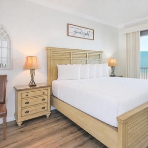 Savor peaceful nights in your king master suite, illuminated by soft lamps, with stunning beach views