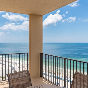 Enjoy breathtaking views of the beach and vibrant umbrellas from the balcony, perfect for relaxation and unwinding