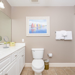 Refresh and rejuvenate in this guest bath, with ample space for your personal care routines in a calming vibe