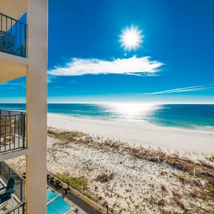Savor your morning coffee on the balcony while enjoying breathtaking views of the water and beach