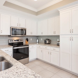 Create culinary delights in the kitchen, furnished with stainless appliances and ample counter space for creativity