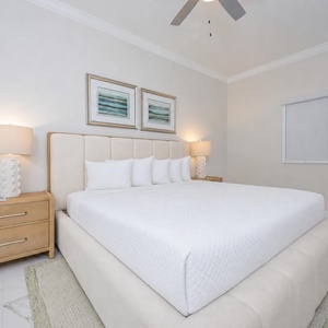 Experience restful nights in this guest bedroom featuring a king bed, stylish decor, and soft lighting