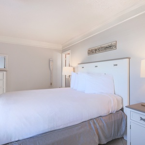 This bedroom features a comfortable bed, stylish decor, and a serene ambiance for a restful getaway