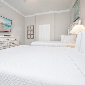 Rest in soft, queen bedding while enjoying your favorite shows in this cozy guest suite