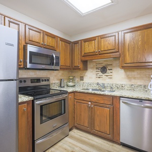 Create delicious meals surrounded by thoughtfully arranged cabinetry and stainless steel appliances