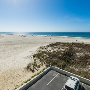 Enjoy breathtaking views from your balcony, soaking in the vibrant vibe while watching beachgoers below