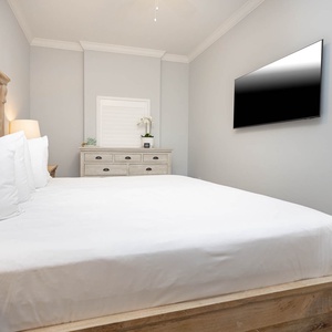 Unwind on the king master suite, watch your favorite shows on the wall TV, and relax after a day of adventure