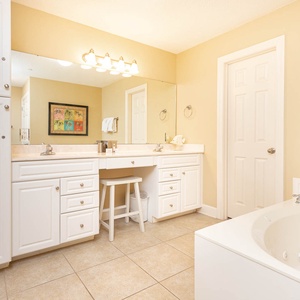 Indulge in relaxation in the master bath with a refreshing walk-in shower and soothing jetted tub