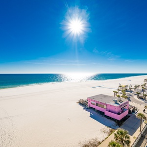 Enjoy seemingly endless views of the Gulf Shores coastline, overlooking the public beach and the Pink Pony Pub