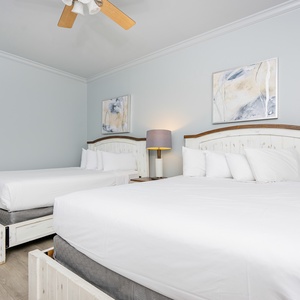 Relax on one of the cozy queen beds in this guest suite and enjoy a peaceful slumber