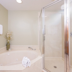 Indulge in relaxation in the master bath with a refreshing walk-in shower and soothing jetted tub