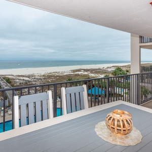 Enjoy meals or drinks on the balcony while taking in the beach view and nearby pool area