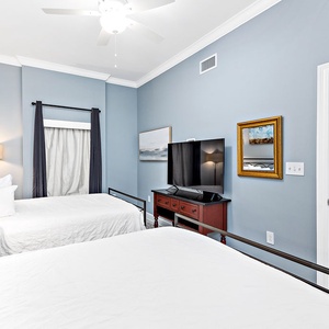 Soothing guest suite with two cozy queens and stylish decor