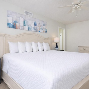 Experience soothing sleep on the plush king bed, surrounded by calming decor and inviting soft pillows in the guest room
