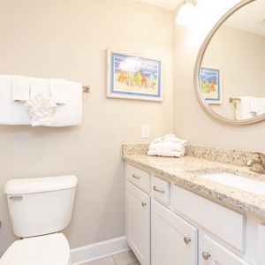 Freshen up in this guest bath in the relaxing shower or soothing tub before an exciting beach day