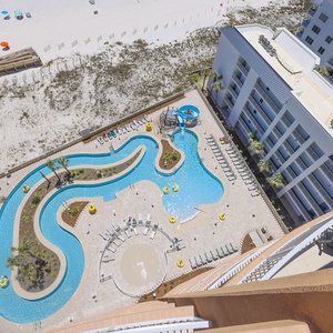 Discover the inviting pool area with a refreshing lazy river and thrilling waterslide