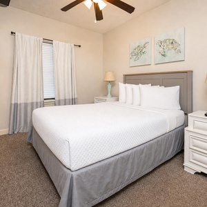 A queen guest suite offers a peaceful spot to unwind while watching your favorite show on the wall TV
