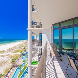 Enjoy captivating views from the spacious balcony overlooking the sparkling beach and inviting lazy river