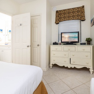 Relax in this guest room featuring cozy queen beds, a TV for entertainment, and an en-suite bathroom