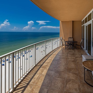 Sip your morning coffee on the spacious balcony, enjoying panoramic views of the shimmering water