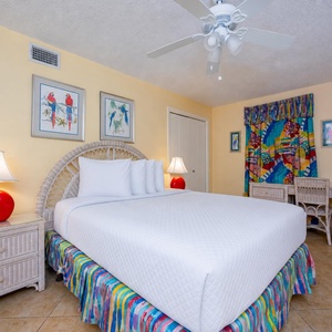 Cradle a restful night in the queen bed of the guest suite surrounded by cheerful tropical decor
