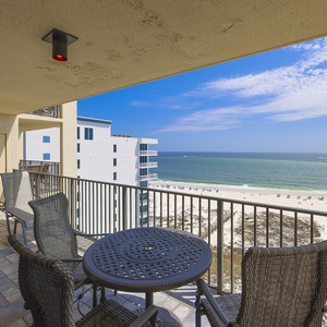 Balcony seating offers a perfect spot to enjoy the serene gulf view and gentle sounds of the beach below