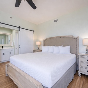 Soft lamps beside the king bed in the master suite create a calm retreat for restful nights and quiet mornings