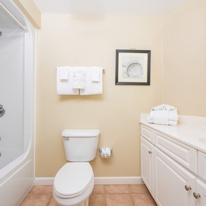 Refresh and invigorate in a guest bathroom with plush towels and inviting coastal decor, perfect for your getaway