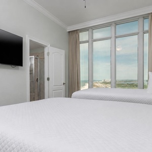 Stream your favorite shows to unwind after a day at the beach and relax with a coastline view from your queen guest room
