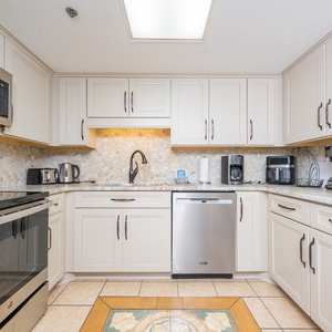 Brew your morning coffee amidst the chic decor and enjoy leisurely chats while starting your day in the inviting kitchen