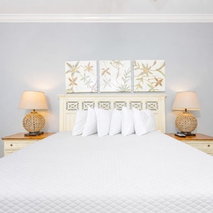 Soothing guest bedroom featuring a king bed and soft lighting