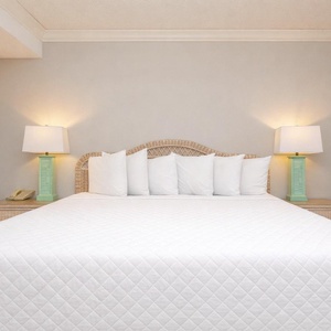 Drift into relaxing sleep on the plush king bed, surrounded by soft linens and fluffy pillows