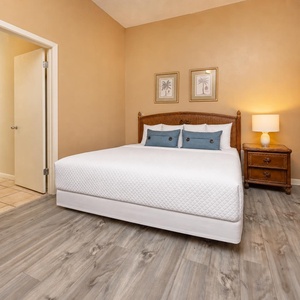 Sink into plush bedding in this cozy queen guest suite and unwind as soft light fills your relaxing retreat