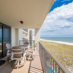 Balcony seating offers a relaxing spot to enjoy views of the beach and gulf, perfect for unwinding after a day of fun