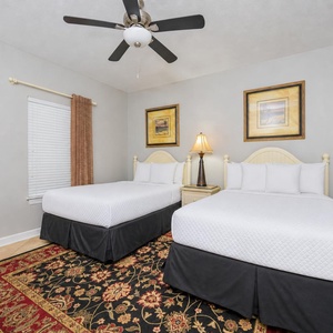 Soft lighting and gentle fan breeze create calm in the guest suite with two doubles for restful nights