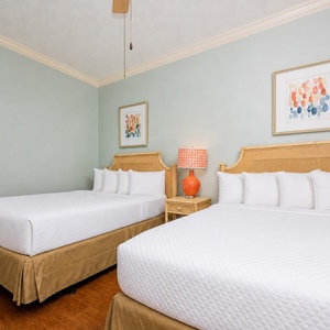 Rest comfortably in this queen guest suite, where plush bedding awaits after a fun-filled day by the beach