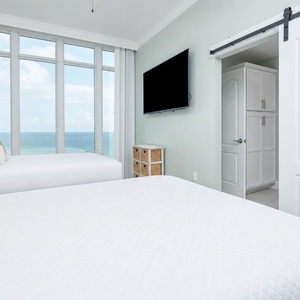 Unwind in this queen guest suite and stream your favorite shows or enjoy a good movie after a beach day