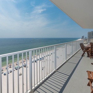 This balcony offers stunning beachfront views with comfortable seating, perfect for relaxing and enjoying the scenery