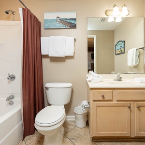 Refresh in the bathroom featuring a spacious tub-shower, modern fixtures, and ample counter space for your essentials