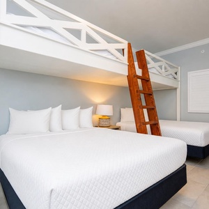 Experience comfort in this guest room with cozy double loft beds above two double beds